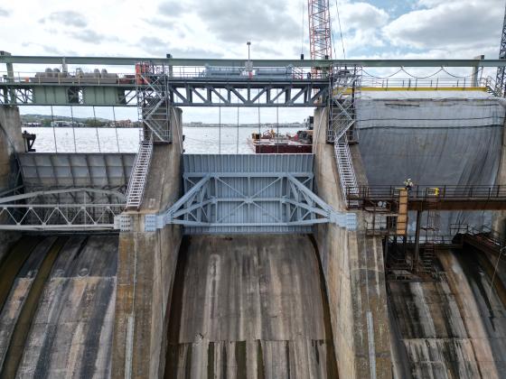 The first of 10 new floodgates is in operation at Wirtz Dam in Burnet County. The new floodgate is in the middle. On the right is the next floodgate to be replaced. 