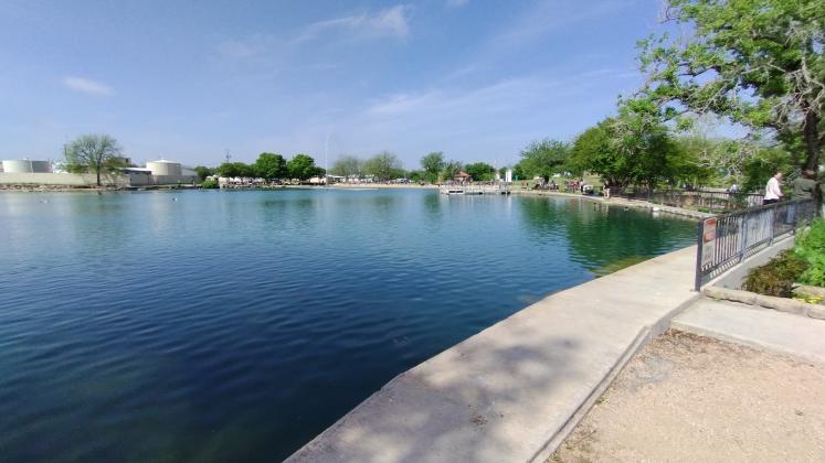 Visitors enjoying the beautiful water at Mill Pond Park - photo by Yvonne Contreras
