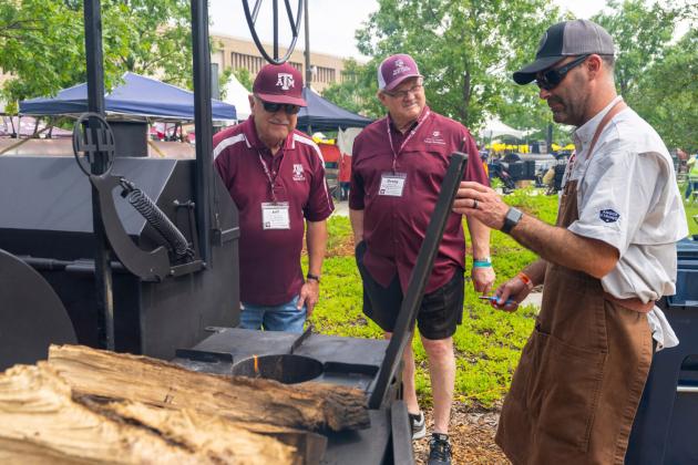 Brisketeers speak with barbecue pit masters at Troubadour Festival in Aggie Park on Saturday, May 20, 2023. Michael Miller/Texas A&amp;M AgriLife Marketing and Communications