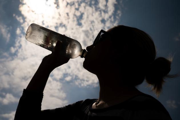 Staying properly hydrated throughout the day is one of the most important steps for avoiding serious heat-related illnesses like heat exhaustion or heatstroke. Laura McKenzie/Texas A&amp;M University Division of Marketing &amp; Communications