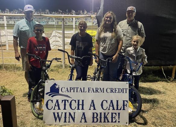 Capital Farm Credit Calf Scramble Winners-Saturday night Marcus Amthor presenting bicycles to: Lily Manning, Paisley Dubose, Scarlet Smithson, and Kyler Bessent