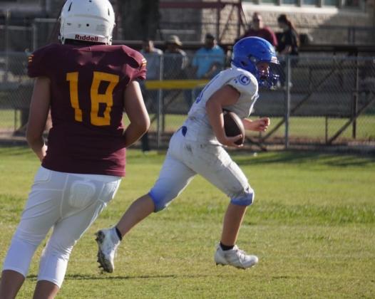 Caden White carrying the ball against Lometa in the junior high game Courtesy of Valerie Valdez