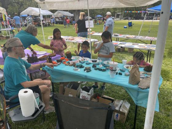Children painting Faith Rocks at the 2024 Diez Y Seis celebration Courtesy of Sarah Saldivar