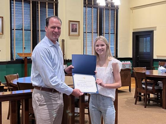 Congressman Pfluger presents award to Tegan Sartor