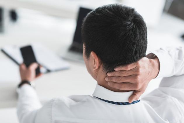 The sedentary nature of work and prolonged use of hand-held devices and computers have contributed to a sharp increase in neck pain. Getty Images