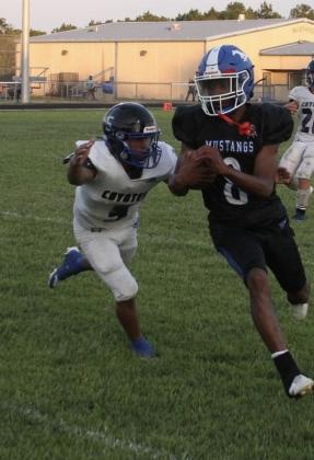 #5 E. J. Aviles closing in on an unsuspecting Mustang in last week’s overwhelming win.