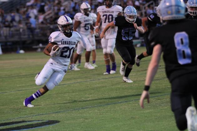 Alex Aguirre sprints to the end zone in a score last Friday against the Cougars. Photos courtesy of Kayti Lackey - 1916 Athletics