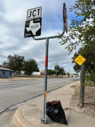This is a bag of trash collected by a volunteer and left on the highway edge so city employee with go by and pickup.
