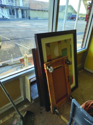 Wall decor and the new bathroom mirror waiting to be hung
