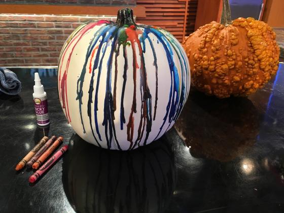 Extend the life of pumpkins by creating crayon-dripped pumpkins rather than carving. Courtesy of MelindaMyers.com