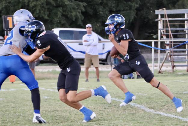 #13 Cohen Ethridge with the ball; #8 Ethan Deeds with the block / Courtesy of Sarah Locker