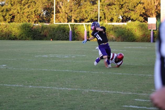 Skylar Romero breaks a tackle on the opening kickoff in the Hamilton’s game last week.  / Courtesy of Kayti Lackey - 1916 Athletics