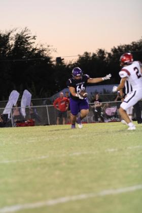 Dawson Crawford punts the ball to Hamilton in Friday’s game against Hamilton.  / Courtesy of Kayti Lackey - 1916 Athletics
