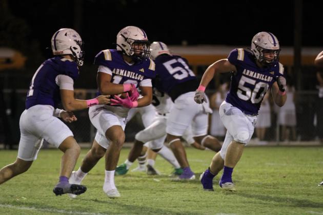 Kolton Pierce (50) lead blocking for Alex Estrada (12)  Courtesy of Kayti Lackey – 1916 athletics