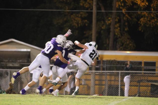 Kolton Pierce (50) and Adrian Martinez (80) with the big hit. Courtesy of Kayti Lackey – 1916 athletics