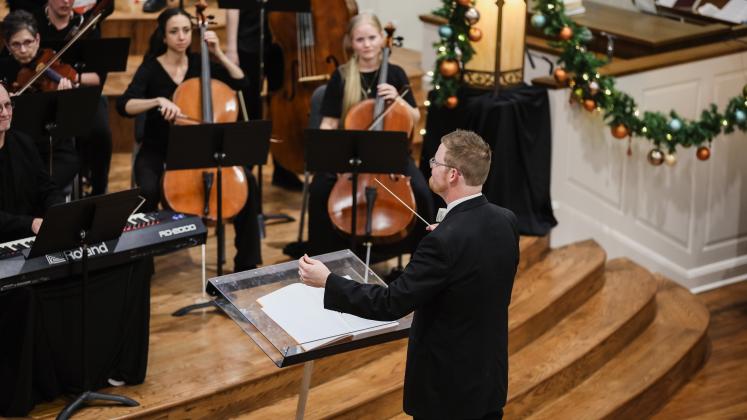 Dr. Chris Rosborough, associate professor of music, director of choral activities and chair of the Department of Music, conducts HPU’s Christmas concert.