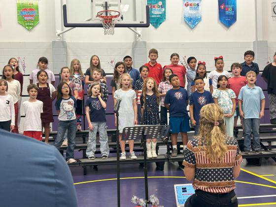 3rd grade class singing patriotic songs at the Veterans Day Program