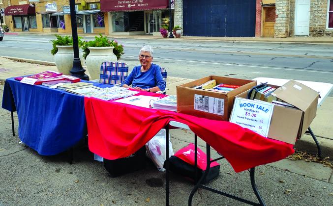 Lynn Blankenship manning the Historical Society/museum/library booth