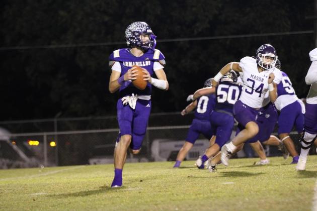 Glover rolls out looking for a receiver against Mason last week. Courtesy of Kayti lackey - 1916 Athletics