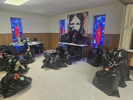 Angel Tree volunteers have sorted, wrapped, and bagged up the gifts for each child.