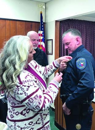 Kristy Newkirk pinning Steven Newkirk during the swearing in service