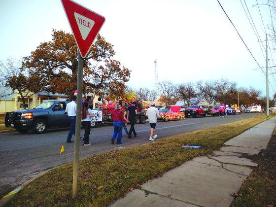 And here are the judges walking down the street - carefully assessing each float. (Djuana Payton)