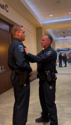 Steven Haviland being pinned by Chief Newkirk at his graduation from the Academy