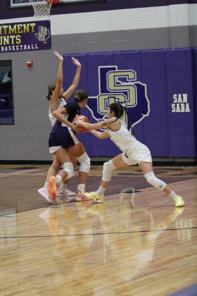 #2 Cinzlea Stanton posting up as #11 Cassidy Gonzalez steals the ball from Mason player