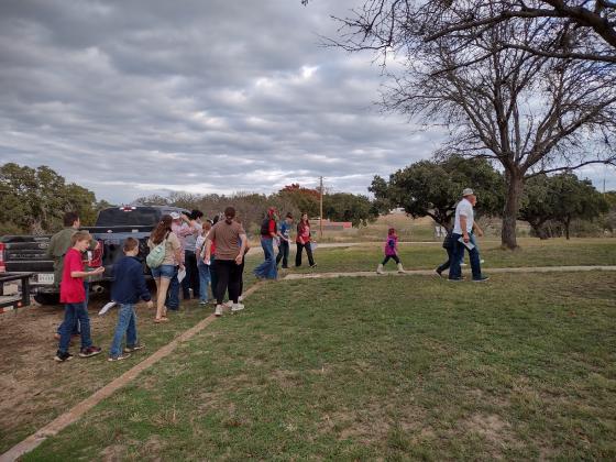 Carolers walking up to the front yard (Djuana Payton)