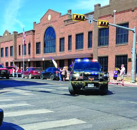 Lady Dillos getting an official escort through town on their way to the State Playoffs! - Photo by Carolyn Preece