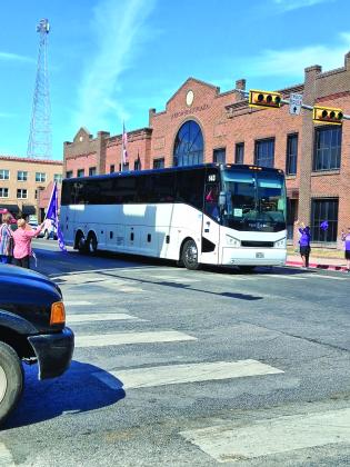 Lady Dillos being cheered on by fans as they make their way through town to San Antonio! - Photo by Carolyn Preece