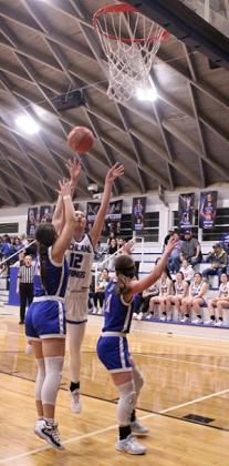 RS #12 Flora Appleton and #21 Amarrea Thomas set their teammate #25 Calyn Kubin up for a wide open 3-pointer to help lead the Lady Coyotes to a BIG WIN over the Cherokee Lady Indians.  Courtesy of Richland Springs Coyote Booster Club