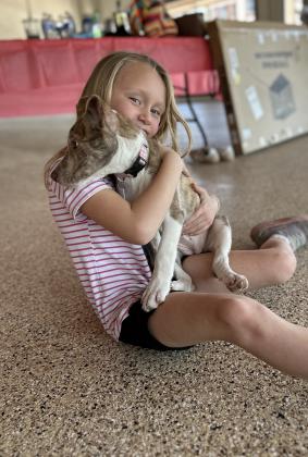 Shannon Horton hugging her furry friend | photo courtesy of Regina Baker