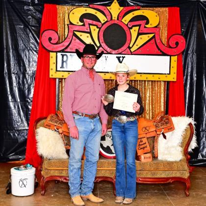 Region X Board President John Dodson is presenting Sydni with her Championship award. Courtesy of  Ricci Grimes-Jones
