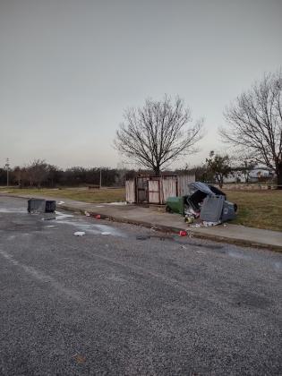 Trash Dumpsters overturned at Mill Pond Park by the Gazebo - By Djuana Payton