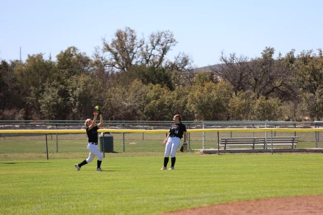 Center field #7 Jayleigh Brand gets under a pop up for an out