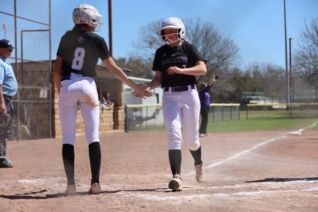 #8 Chassidy Gonzales and #7 Jayleigh Brand crossing home
