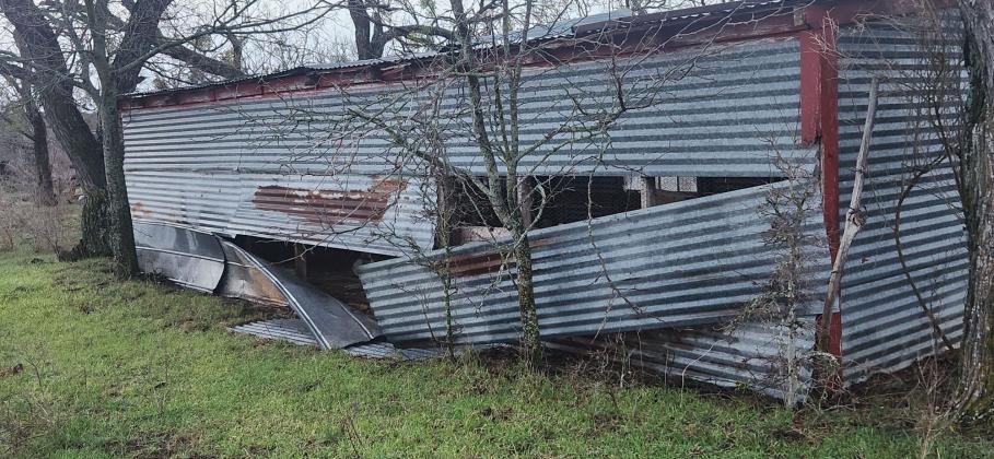 Damage to other side of metal building - By Kerinda Stewart Chaudoin-Turner