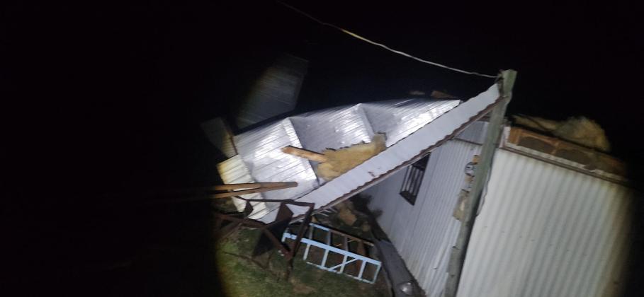 Closeup view of roof completely taken off by wind - By Kerinda Stewart Chaudoin-Turner