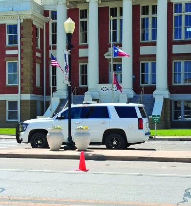Chief's car with flags at half staff - photo by Carolyn Preece