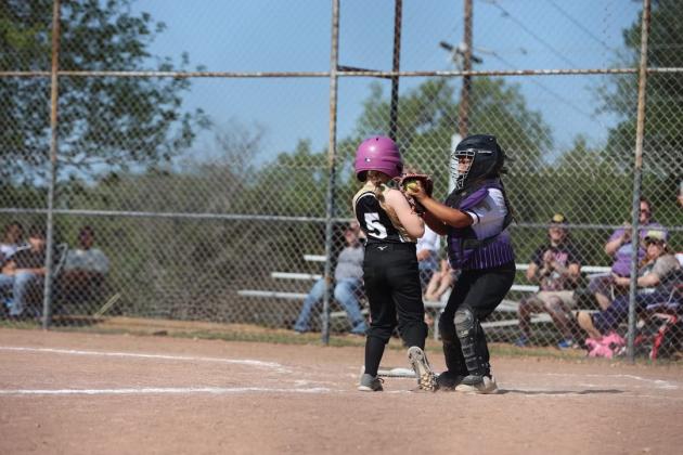 Catcher #5 Evelyn Coronado makes the out at home plate