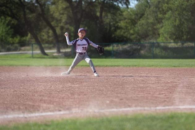 Asher Smith makes a throw from second base