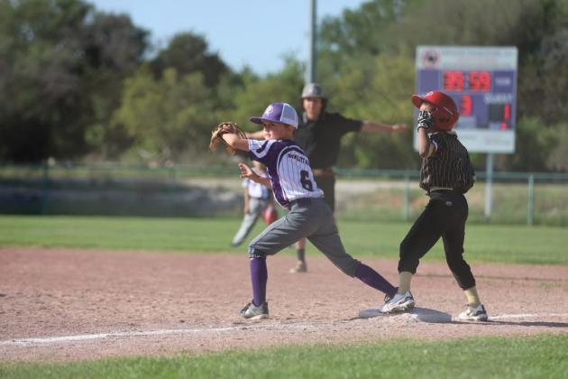 #6 Turner Hensley makes a catch at first base