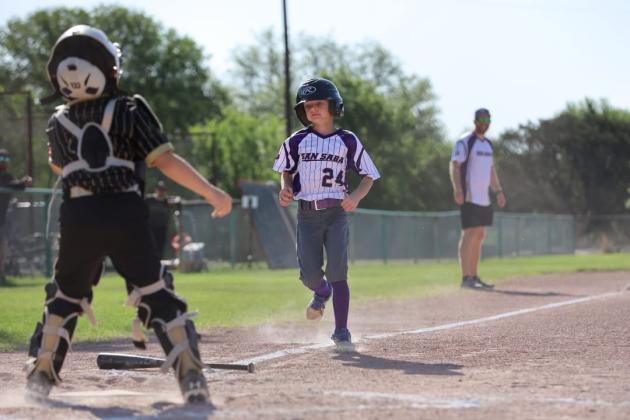 #24 Ethan Smith sliding into home