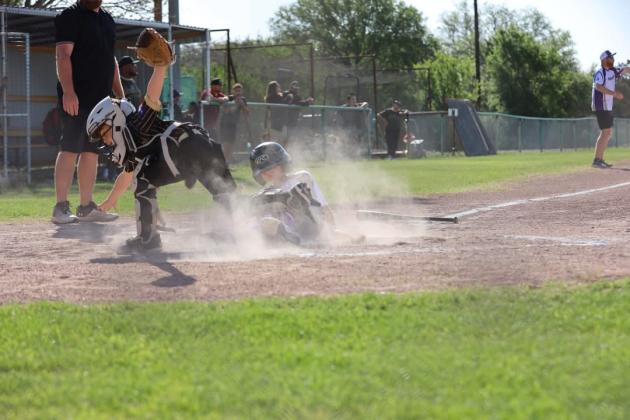#24 Ethan Smith sliding into home