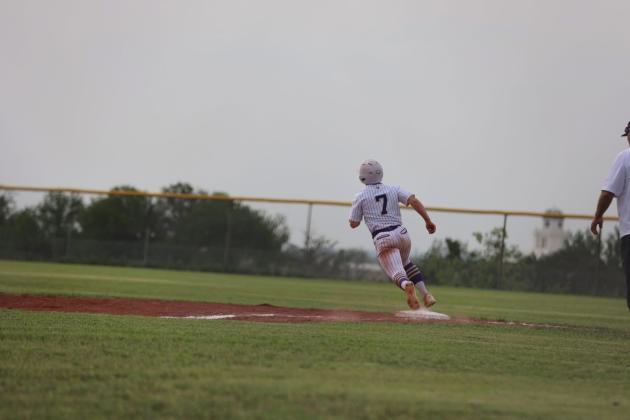 #7 Jason Everett rounding first base