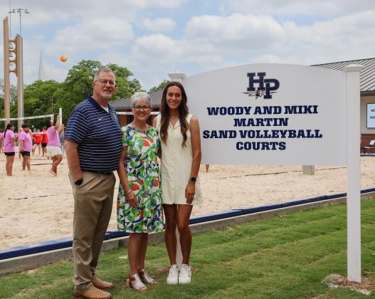 Woody and Miki Martin (left) are pictured with Micah Taylor (right), HPU’s new head beach volleyball coach.