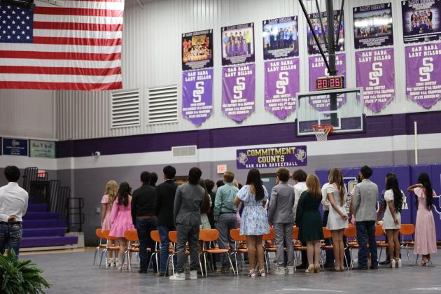 Eighth graders facing the flag for the Pledge of the Allegiance. | Photo courtesy of Kayti Lackey/1916Athletics