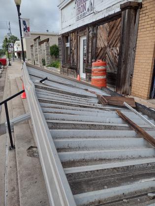 The awning fell just right, and the handrail punctured right through it.. | Photo by Djuana Payton