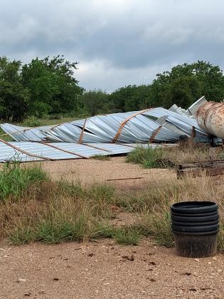 Part of a storage building that belongs to Riggs Feed destroyed by the storm. | Photo by Carolyn Preece